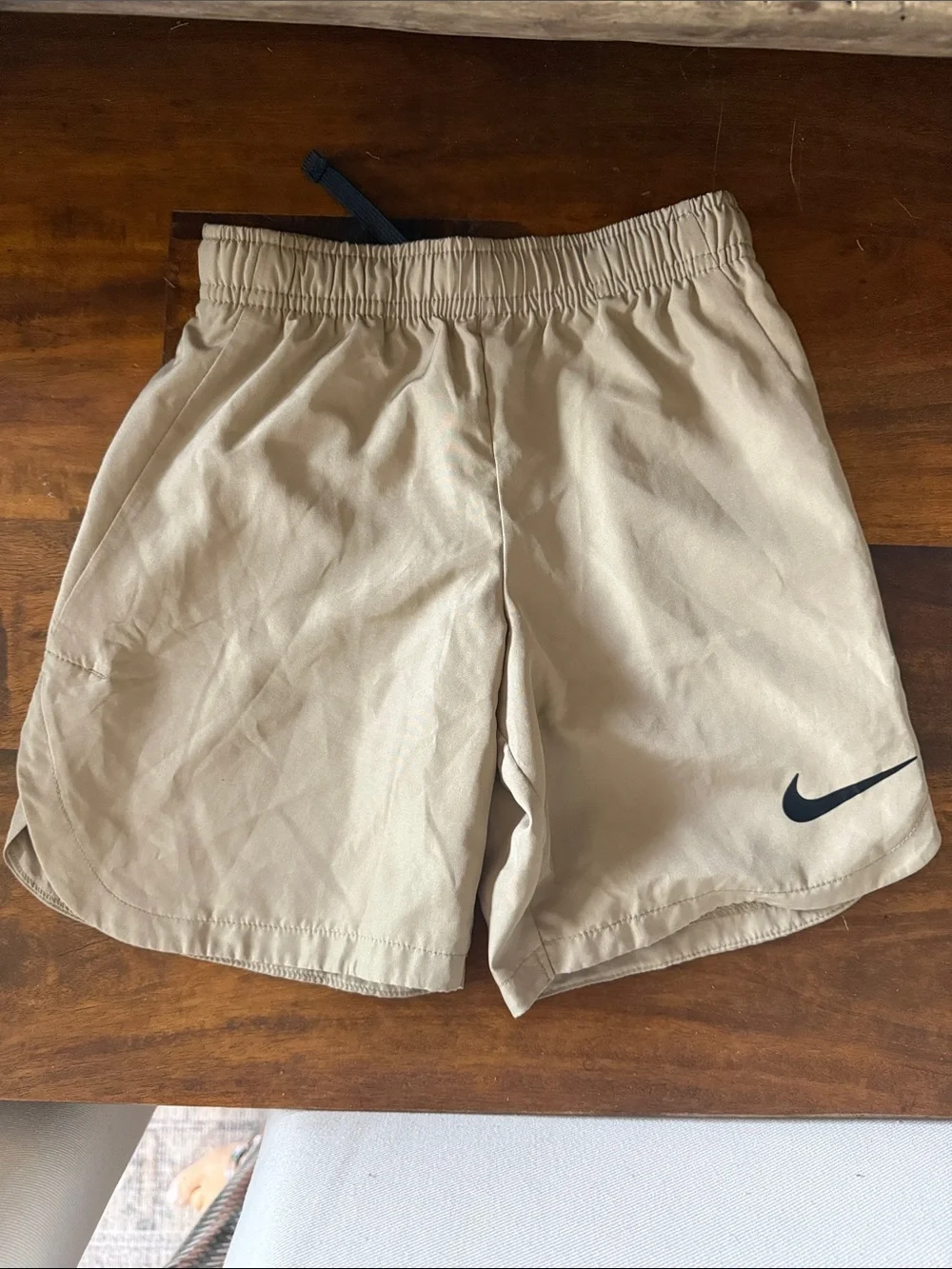 Nike Kids Tan Athletic Shorts with Black Swoosh